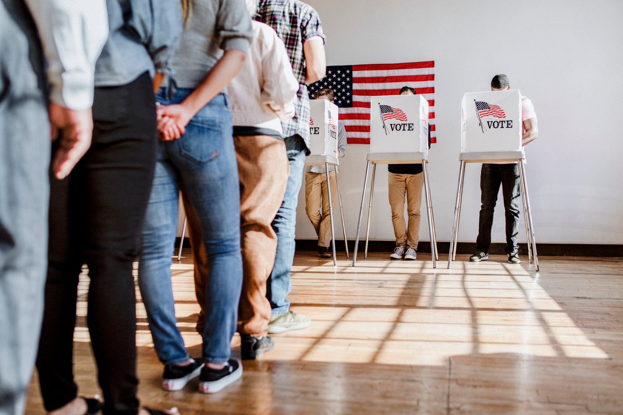 Voters waiting in line at a polling place